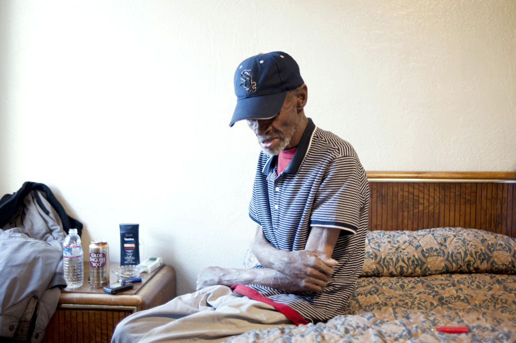 ALISSA AMBROSE/STAT--Foreman rests in an $80 motel room in East Oakland. His monthly income is about $500, and he can rarely afford such luxury.